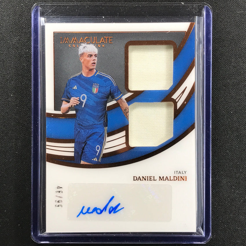 2022-23 Immaculate Daniel Maldini Dual Swatch Jersey Relic Auto Bronze 46/99